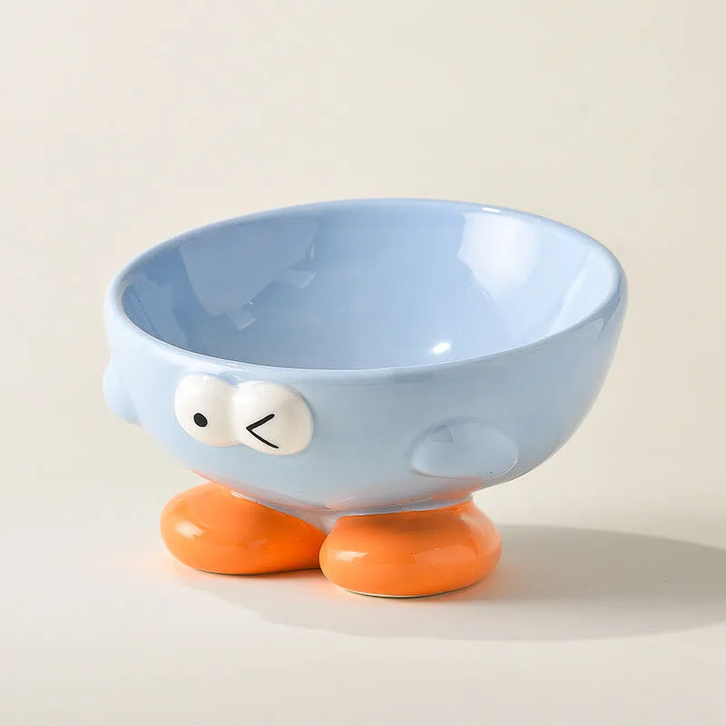 Ceramic pet bowl with oblique design and cute expressions for cervical spine protection