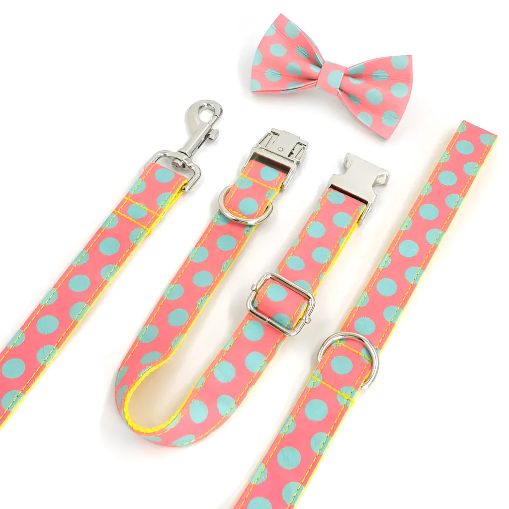 Yellow polka dot dog collar with attached lead rope and fabric bow decoration