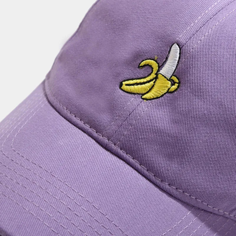 Cute banana fruit embroidered soft top baseball cap on adjustable strap, shown in peacock blue colour.