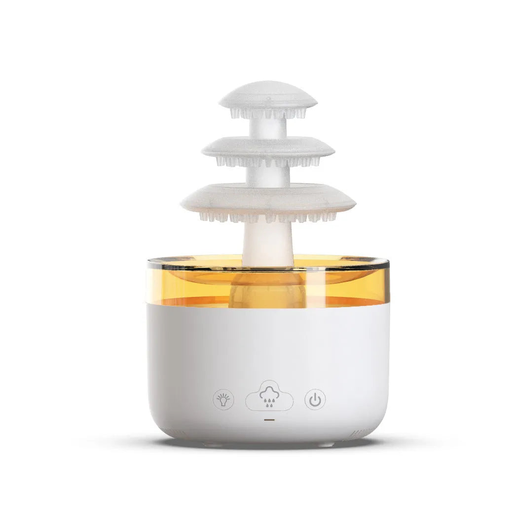 White Cloud Rain air humidifier and essential oil diffuser with colourful LED light on a table.