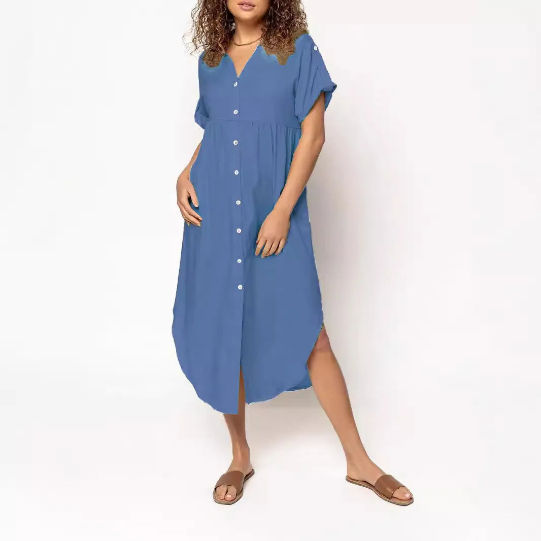 A loose fit, solid colour midi dress with a button front detail, shown in one of eight available colour options.