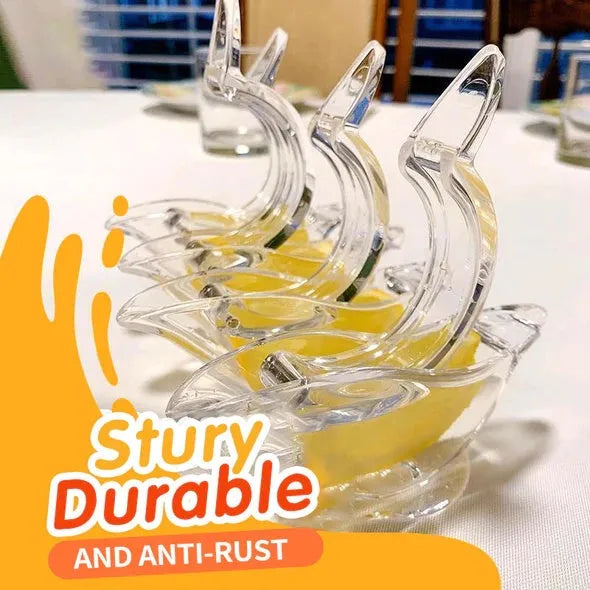 Transparent acrylic bird-shaped manual juicer for lemon slices on a kitchen counter.