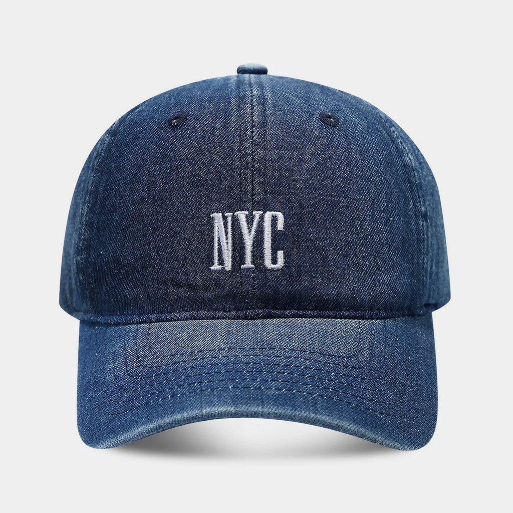 Adjustable denim peaked cap with a dome crown and a large English letter design on the front.