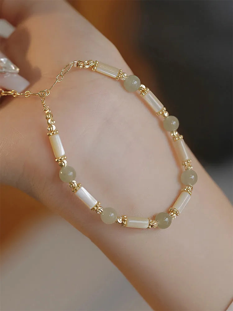 Women's bamboo joint Hetian jade bracelet in 6mm size showing natural stone beads