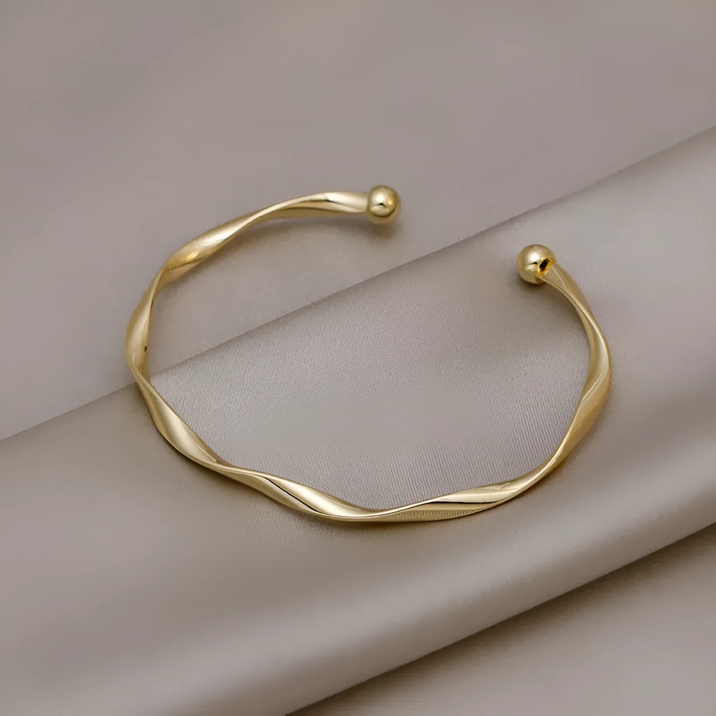 Gold twisted alloy bracelet with geometric Korean style design and 6.2cm inner ring diameter