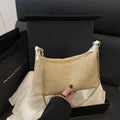 Straw woven beach shoulder tote bag in black colour with polyester lining and sandwich pockets