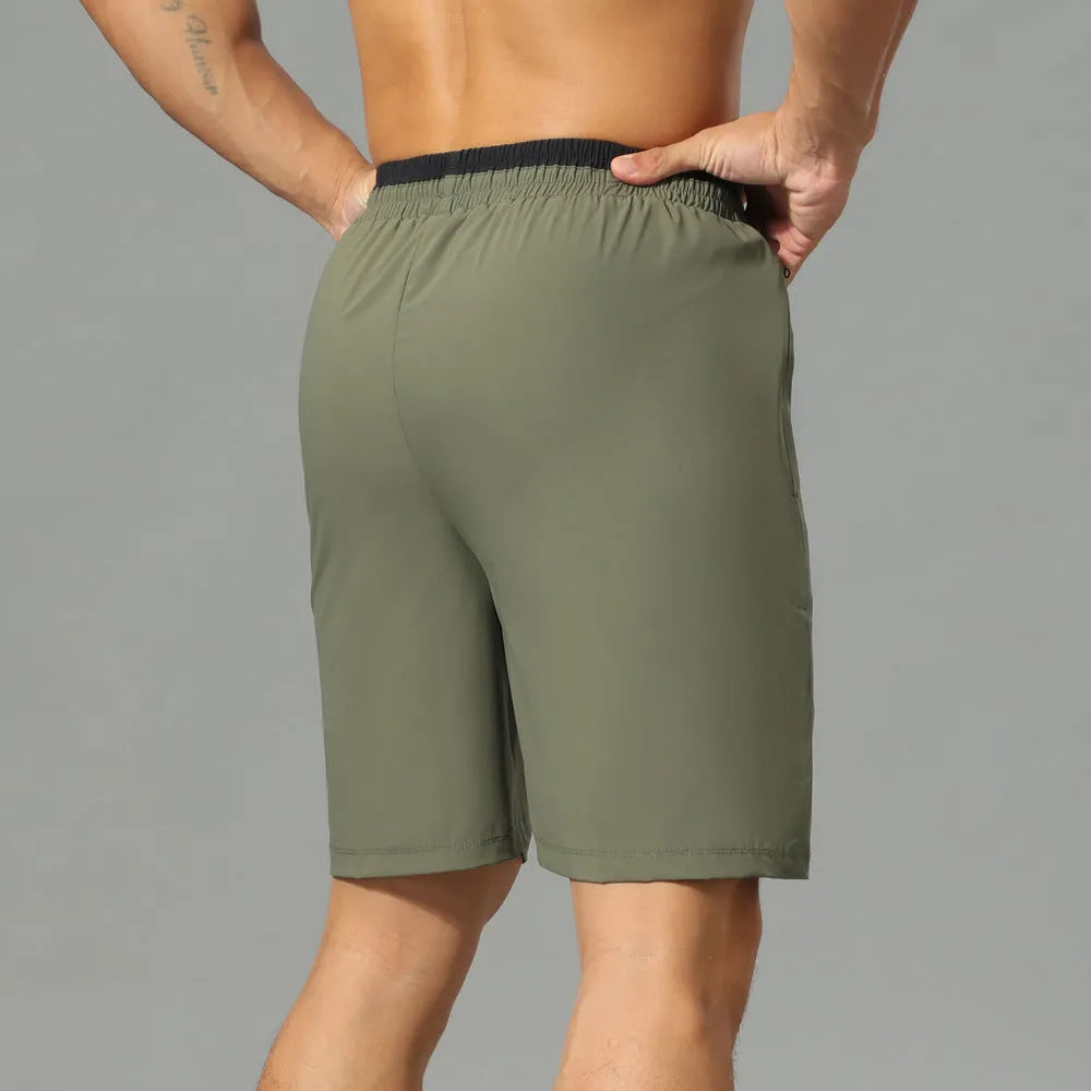 Men's grey loose fit cropped running pants made from quick-dry Ice Silk fabric for workouts.