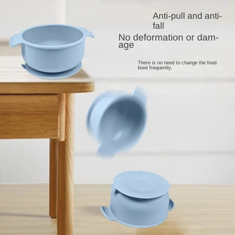 Flexible silicone pet bowl with suction cup base, shown in blue, folded flat next to a dog