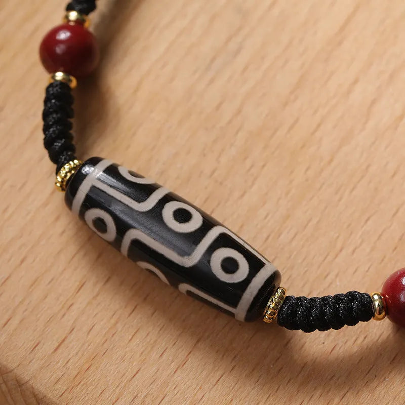 Men's Tibetan agate Dzi bead bracelet with shrinkable adjustable closure showing traditional couple style beadwork