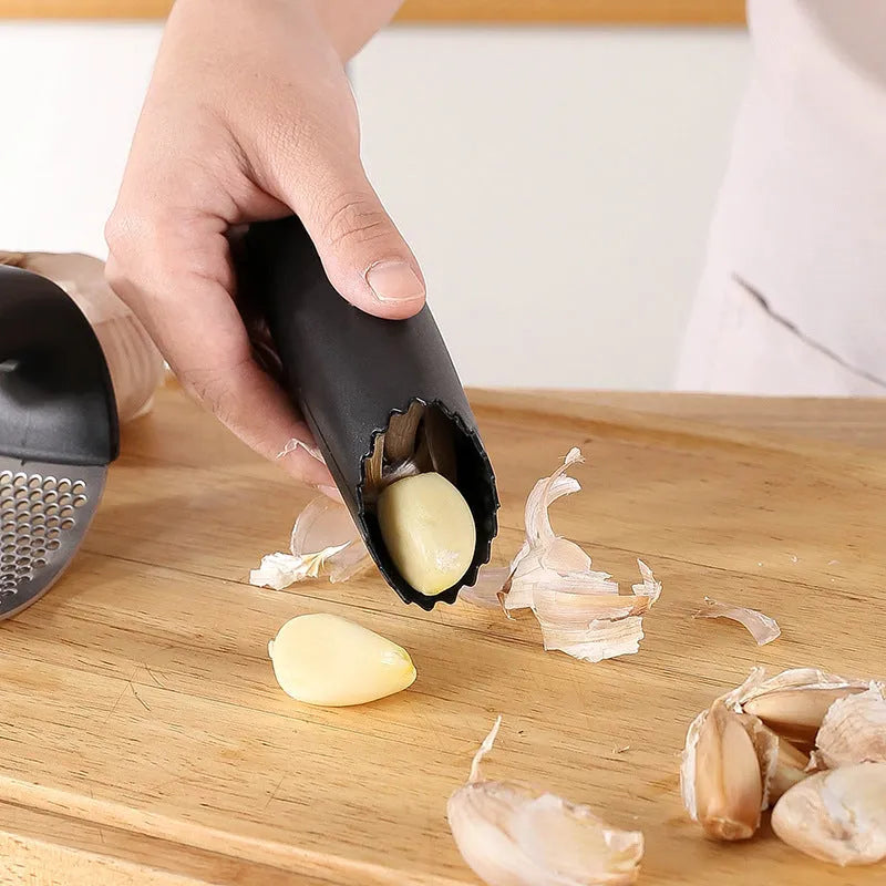 304 stainless steel garlic press with PP handles in four colour options measuring 11 by 7 centimetres