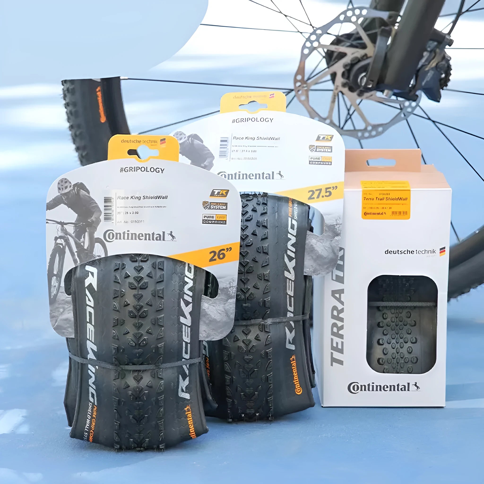 Mountain bike folding tyre shown in yellow and white for 26, 27.5, and 29-inch wheels.