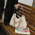Large capacity fur shoulder messenger bag for women, plush material, horizontal square shape, chain and stitching details, apricot colour