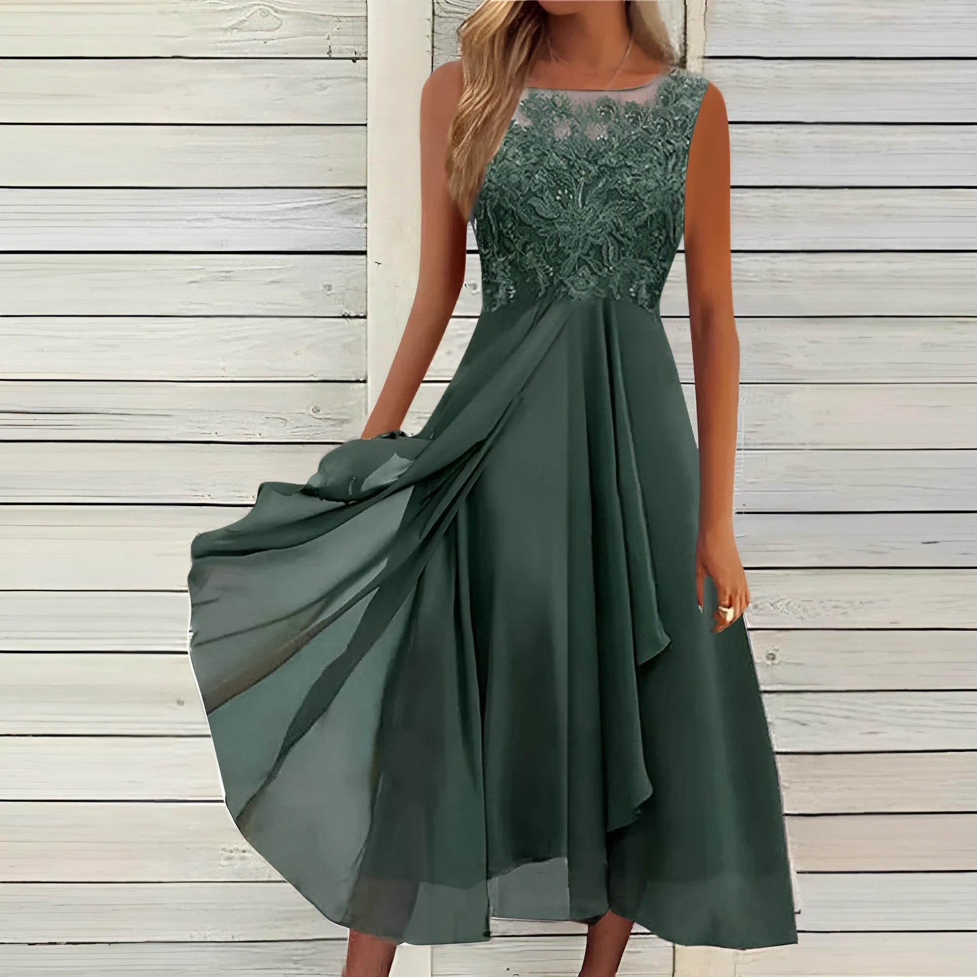 Women's sleeveless green chiffon dress with hollow-out lace detail, mid-length skirt.