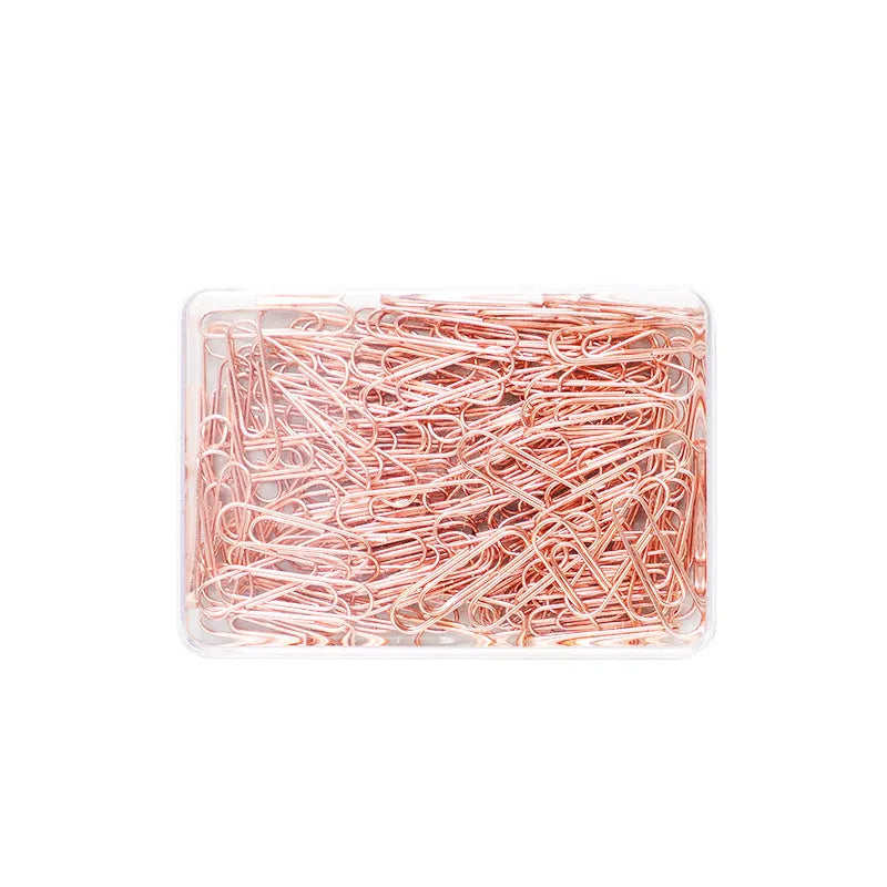 100 rose gold coloured heart-shaped metal paper clips in a box.