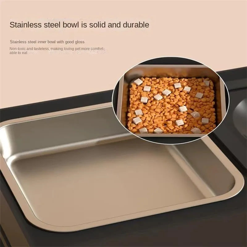 Black adjustable height dog feeding stand with two stainless steel bowls elevated on plastic stand