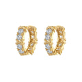 A pair of geometric hexagonal clover cross earrings with an elliptical shape in a gold or silver electroplated finish.