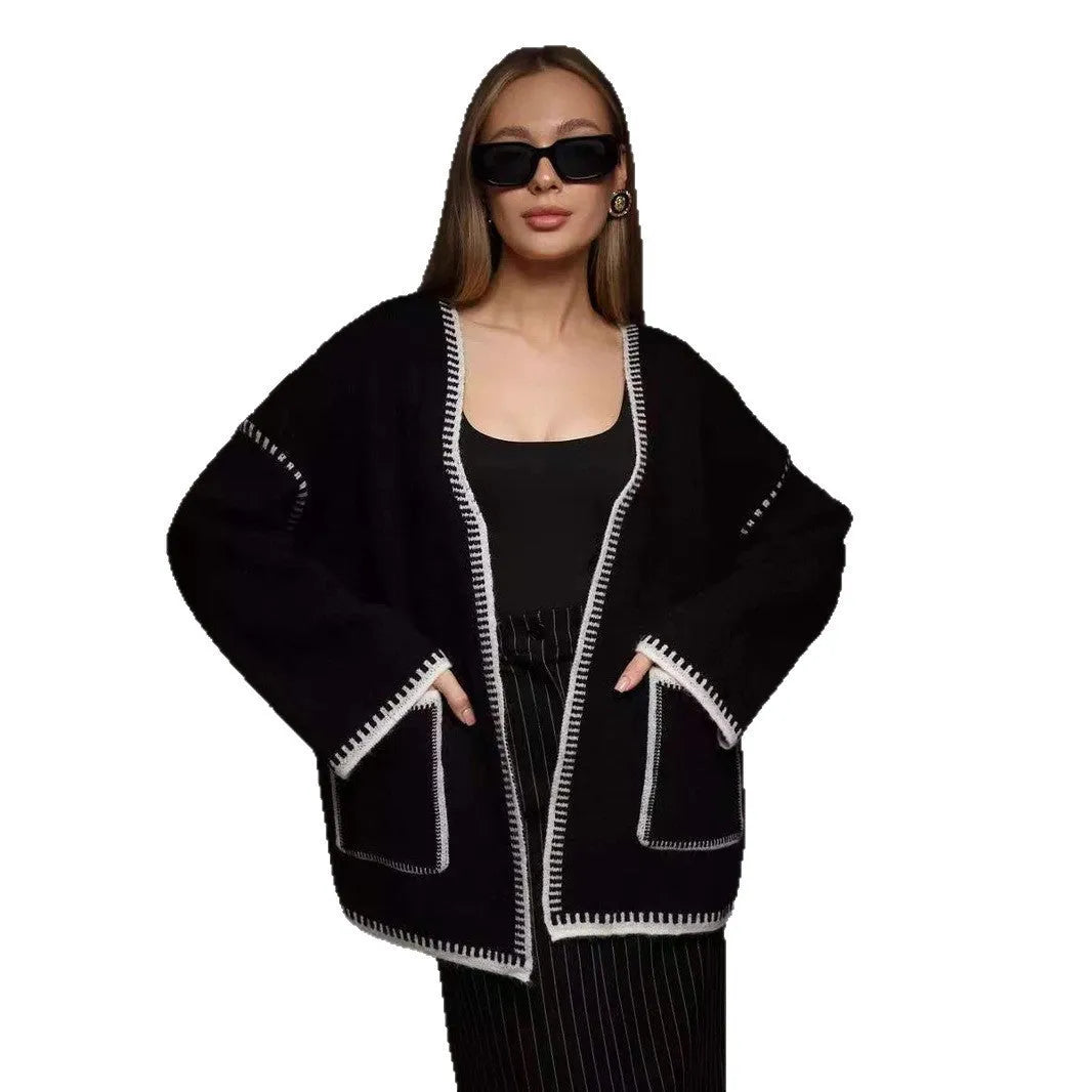 Loose lace-up knitted cardigan in camel colour, showing mid-length fit and long sleeves.
