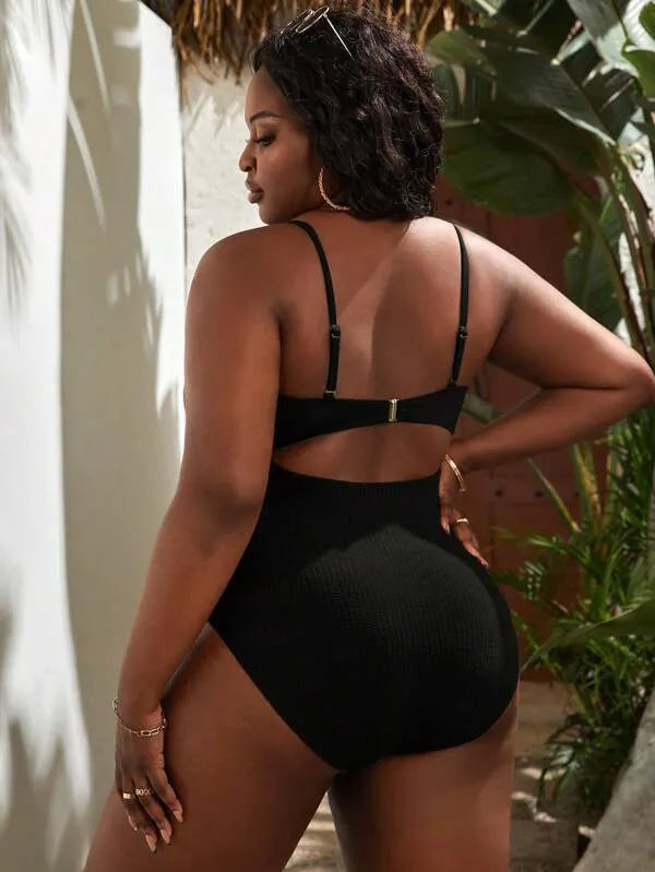Plus size women's black sling triangle one-piece swimsuit with polyester and spandex stretch fabric