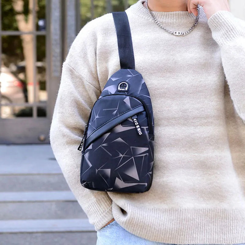 Blue Oxford cloth crossbody messenger bag with a strap, showing a front earphone hole and zipper closure.