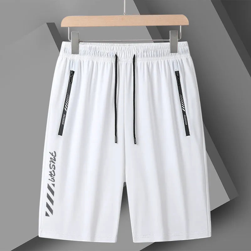 Men's black loose-fit quick-dry nylon sports shorts on a grey background.
