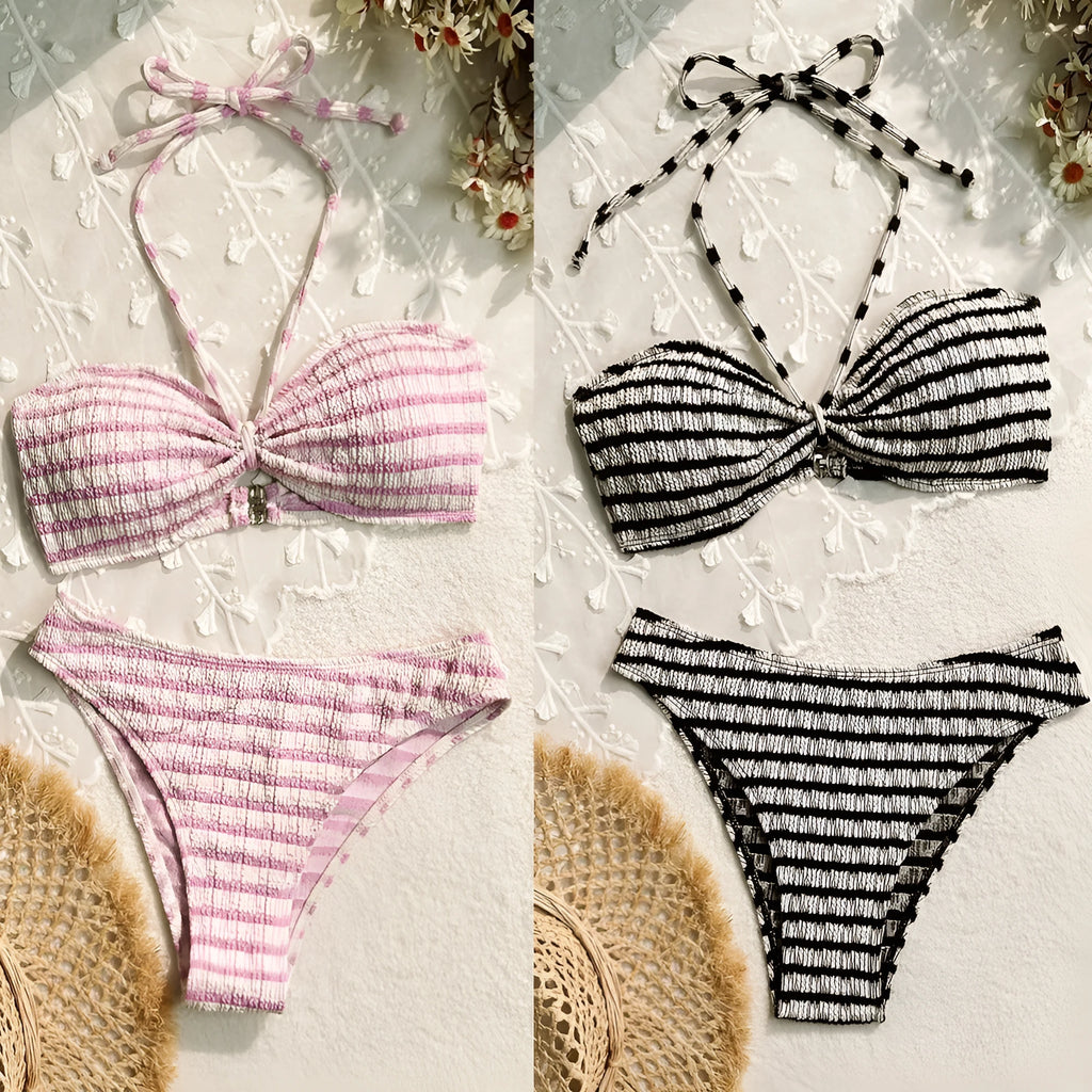 Women's pink and black striped bikini swimsuit with solid briefs.