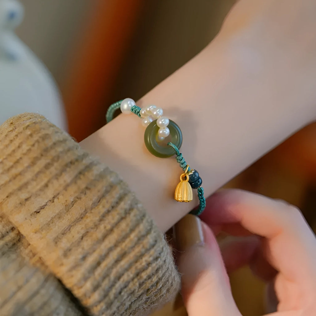 Hand-woven flexible wire watch bracelet with a pearl peace buckle in retro style for women.