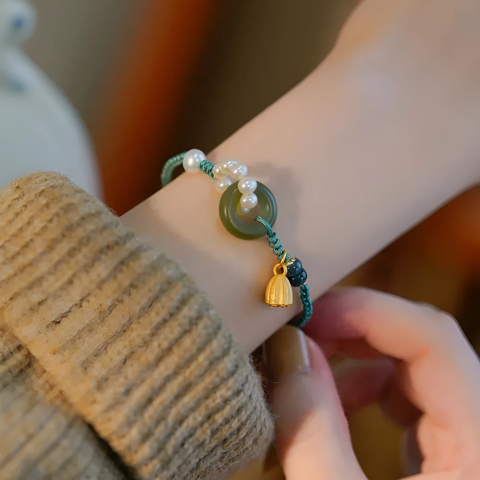 Hand-woven flexible wire watch bracelet with a pearl peace buckle in retro style for women.