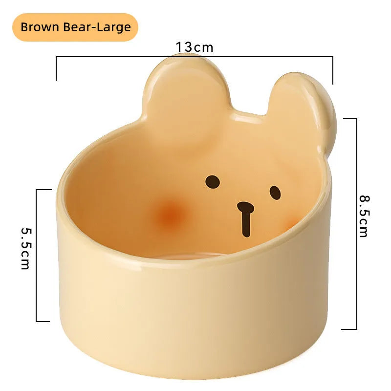 White and yellow ceramic pet bowls with rabbit and bear motifs in two sizes