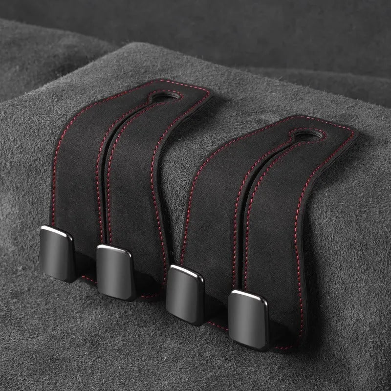 Alloy car seat hook storage bag in black suede fabric shown flipped open and closed on car headrest