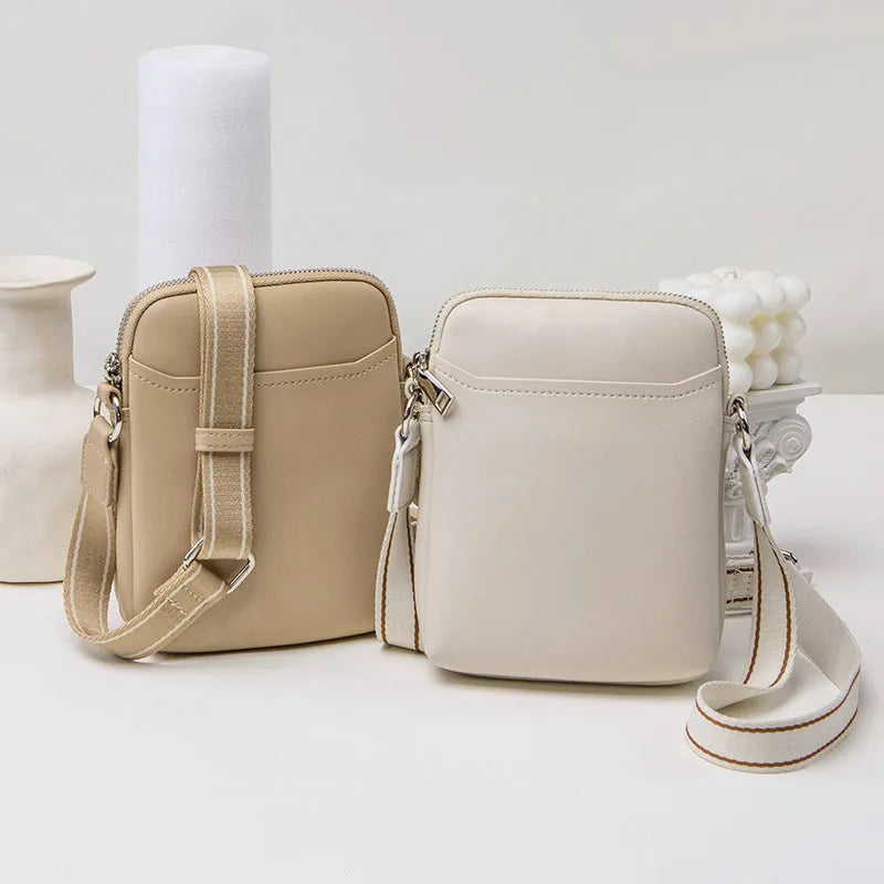 Solid colour PU leather crossbody phone bag for women in beige, showing front view.