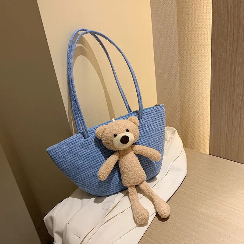 Large woven shoulder bag in cotton and linen fabric with double straps and three-dimensional pockets