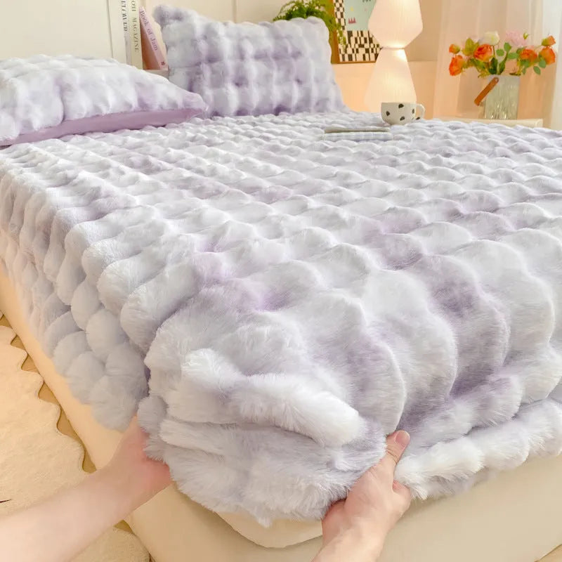 Class A milk fiber fitted sheet with rabbit plush in clear blue, showing elastic edges and smooth surface