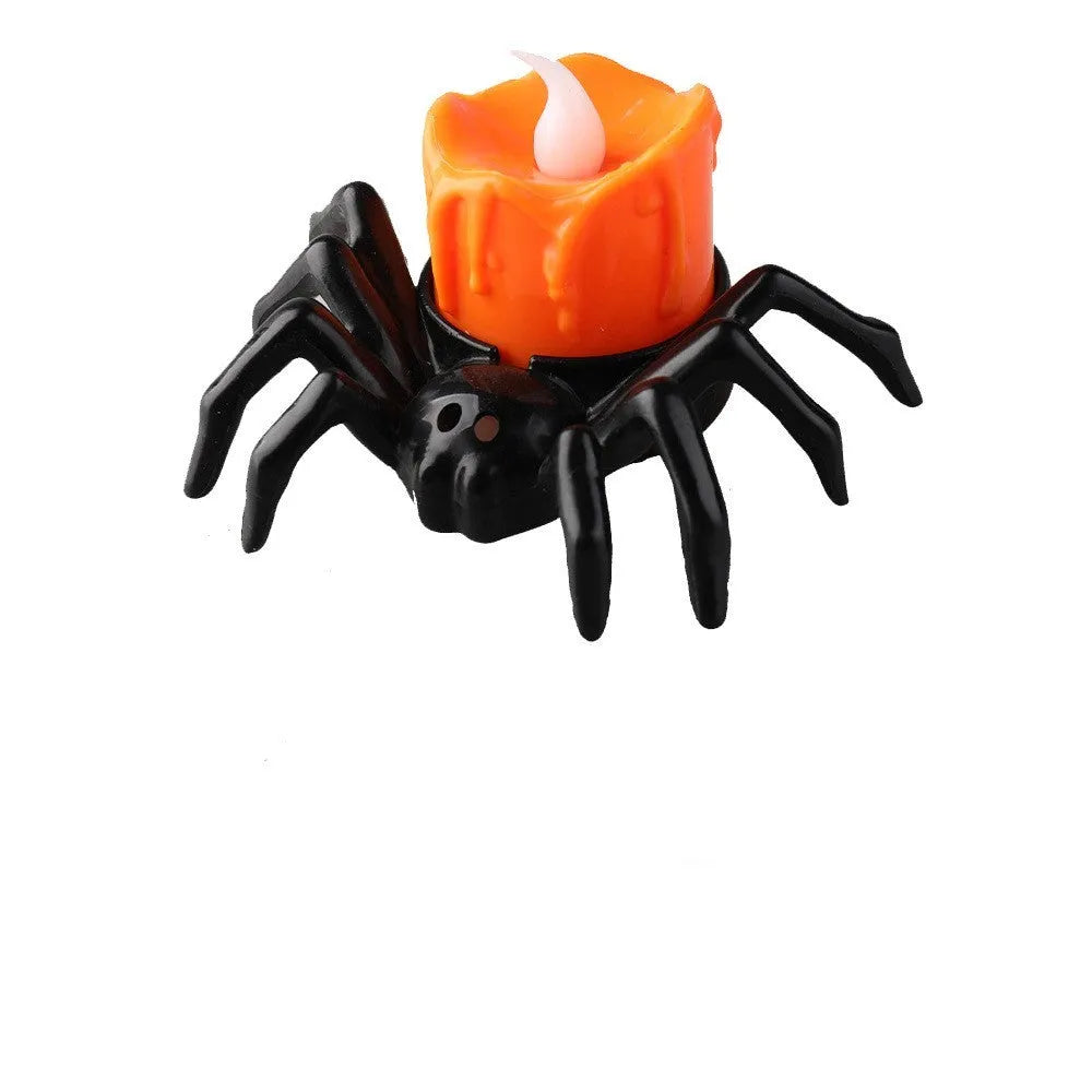 Plastic Halloween spider candlestick ornament with battery-operated candle light.
