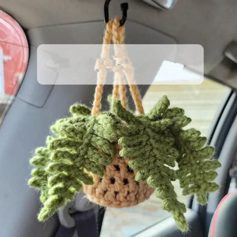 Green and white knitted wool car plant decoration with basin base and hanging rope