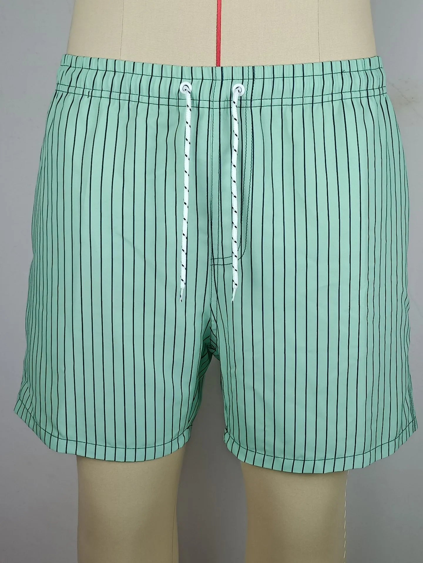 Polyester fibre striped beach shorts with straight leg opening in navy blue colour