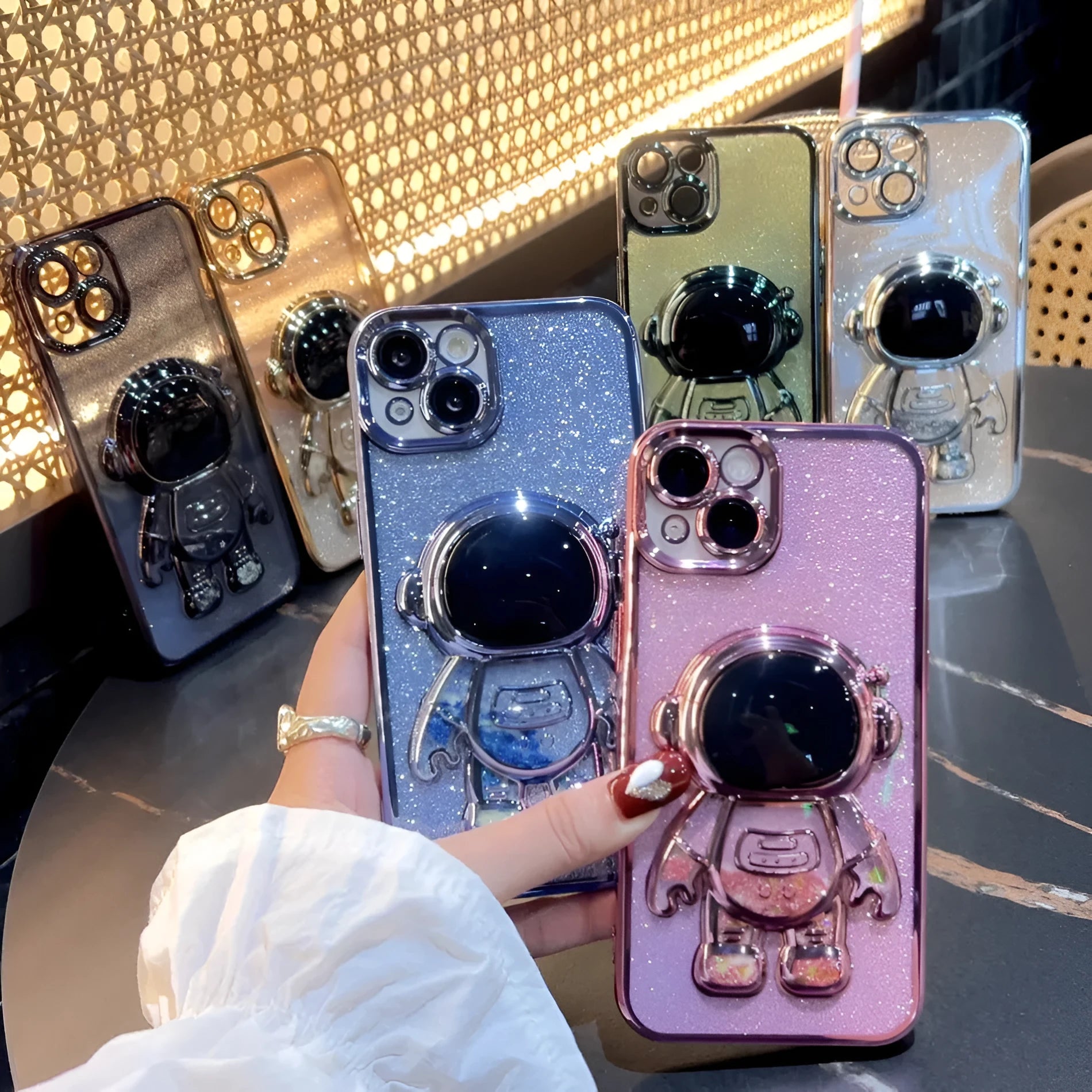 Astronaut spaceman themed iPhone case with quicksand design and glitter electroplated finish in multiple colour options