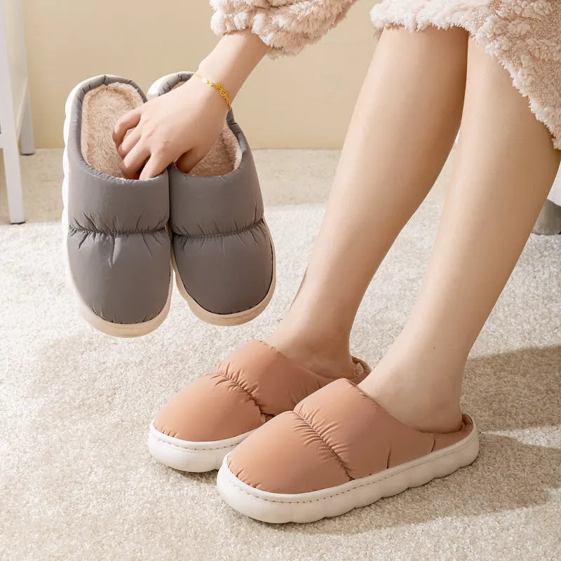 Blue down cotton winter slippers with thick rubber sole and plush lining for indoor use.