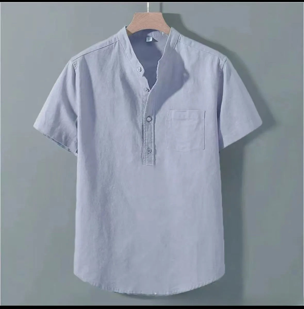 Men's beige casual linen shirt with stand collar and short sleeves in a loose, relaxed fit.