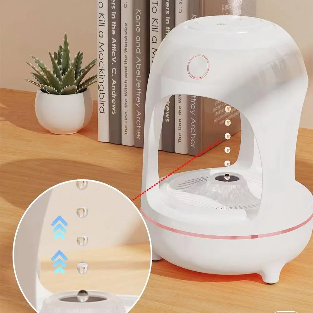 Rose gold and white columnar humidifier with levitating water drops and LED lighting on desk