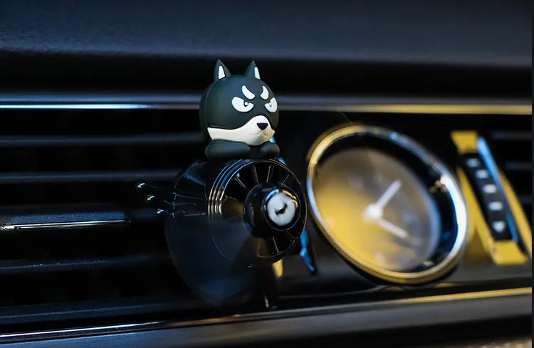 Set of four car air vent ornament designs: black husky, black cat, pink cat, and pink duck on cloth bags.