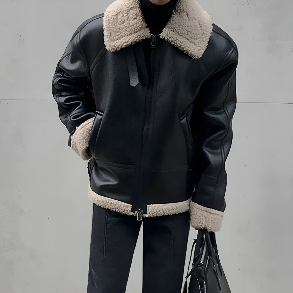 Men's black PU leather jacket with padded collar, front zip, and long sleeves on a model