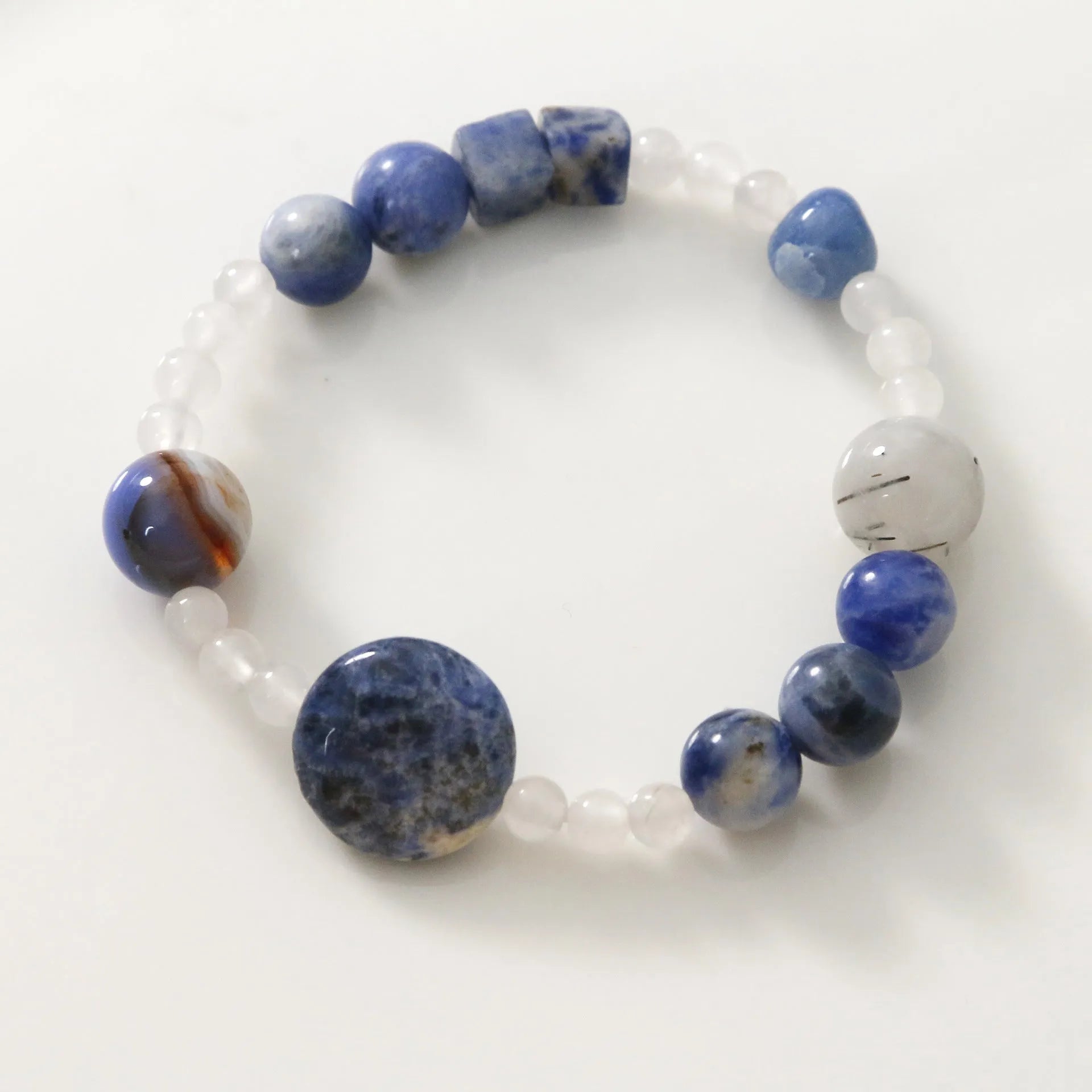 Hand-woven natural stone bracelet with blue point stone and black hair crystal agate beads