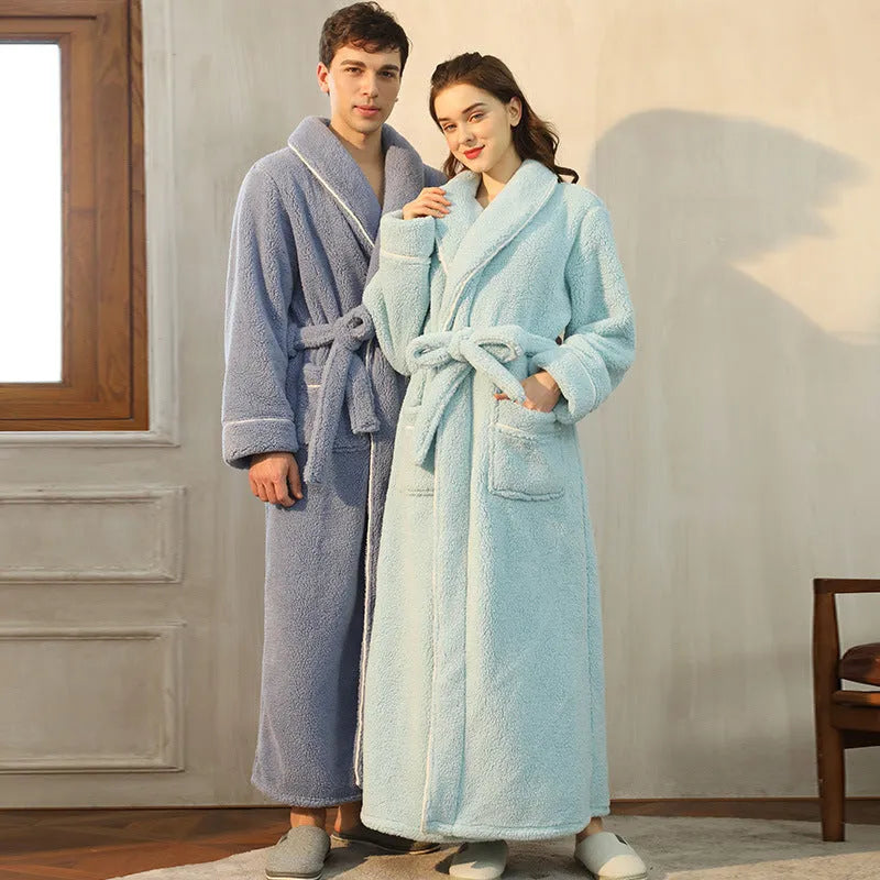 A man and woman wearing matching heavyweight navy blue flannel bathrobes, a couple's winter nightgown set.