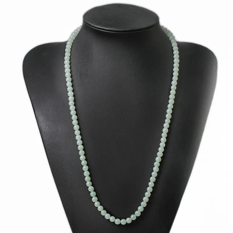 Adjustable jade bead necklace with white green round beads showing length adjustment from 21cm to 50cm
