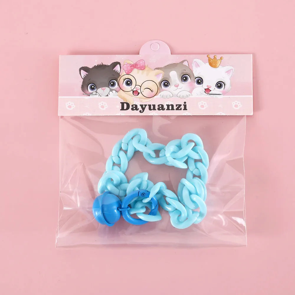 Soft plastic pet collar in pastel macaron candy colours with a chain-link design, shown in S and M sizes.