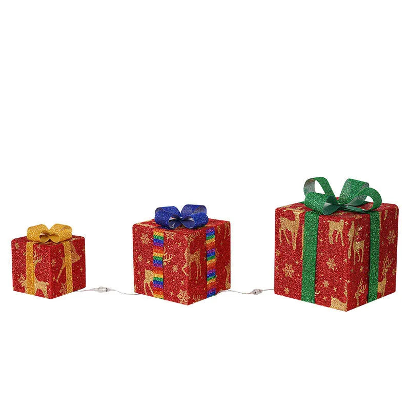 Set of three lighted Christmas gift box decorations with bows for outdoor holiday decor