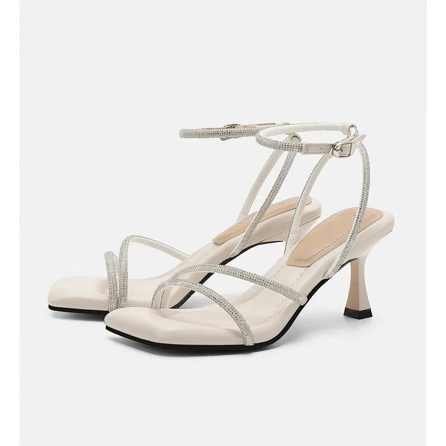 Women's silver rhinestone square-toe sandals with an ankle-strap buckle.