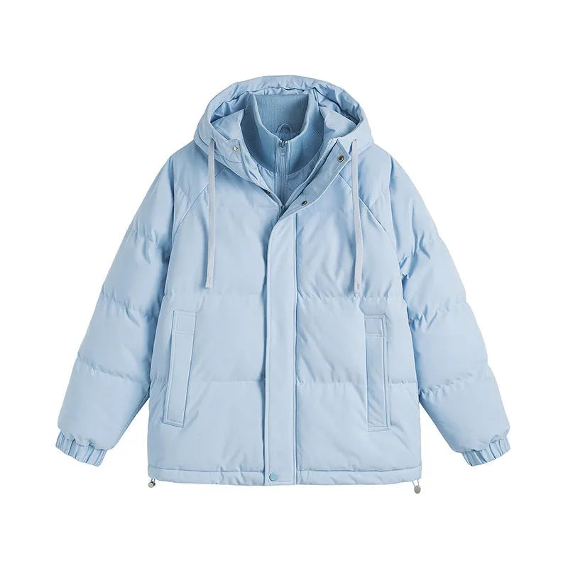 Loose thick polyester cotton-padded jacket in light blue on a hanger showing side seam pockets.