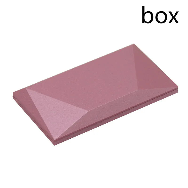Red heart-shaped rotating ring box with 3D white rose decoration on top.