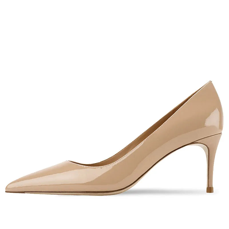 Women's black pointed toe high heel shoes with soft rubber sole on wooden surface